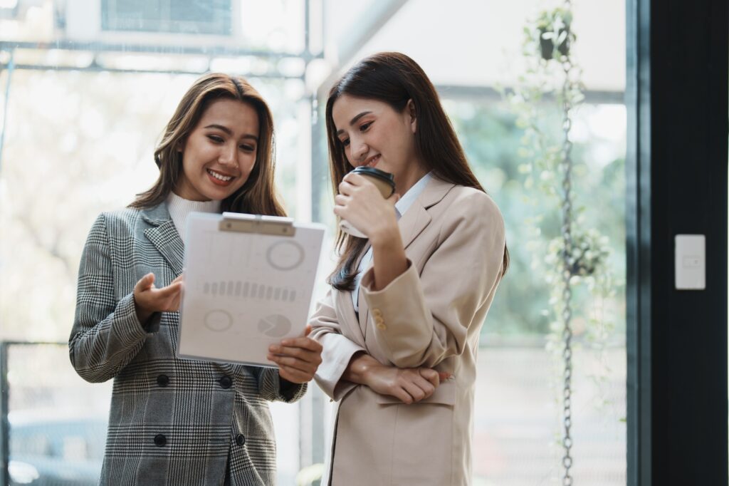 Roof Financing Florida Financial analysts analyzing business reports on planned investment projects during corporate meetin