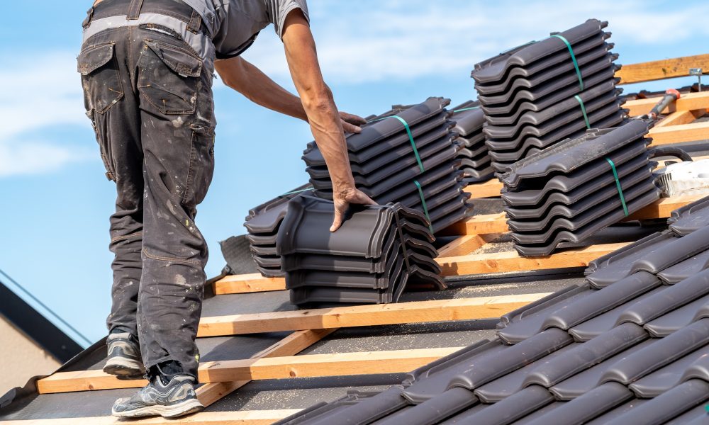 ceramic tiles on the roof, installation of a new roof by an expert