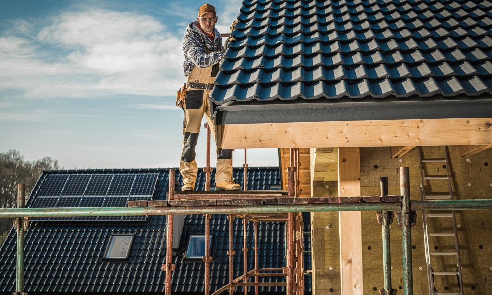 Construction Worker Performing Roof Installation