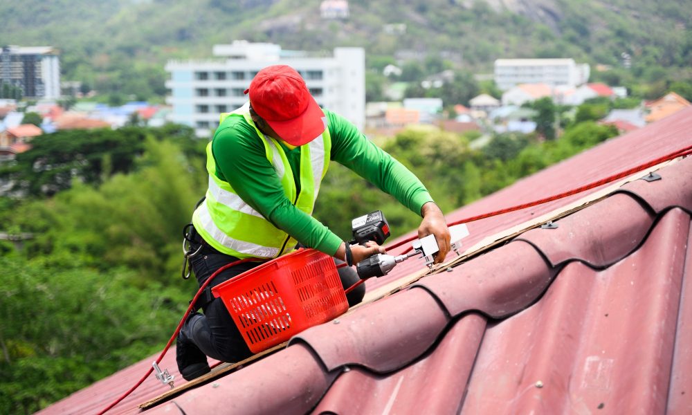 Expert Roof Inspection Company in Florida Professional engineer worker installing solar panels system on rooftop