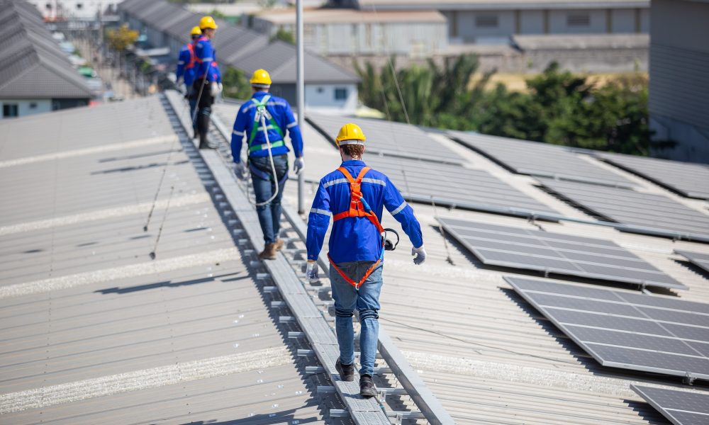 Expert Roof Inspection Company in Florida Technicians are installation and inspection standards of solar panels on roof of an industrial facto